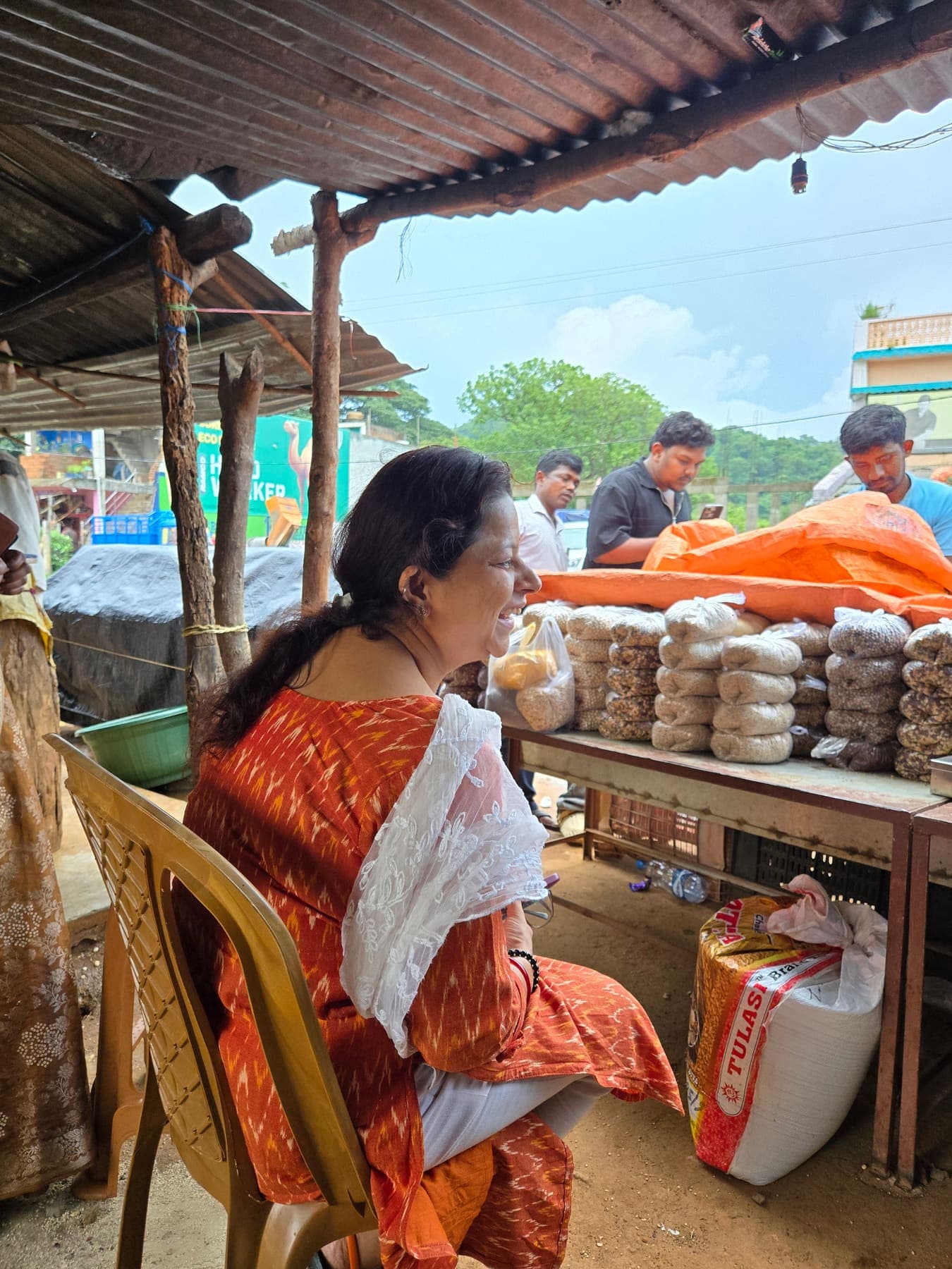 Village produce stall in Kandhamal stacked with graded rice packs