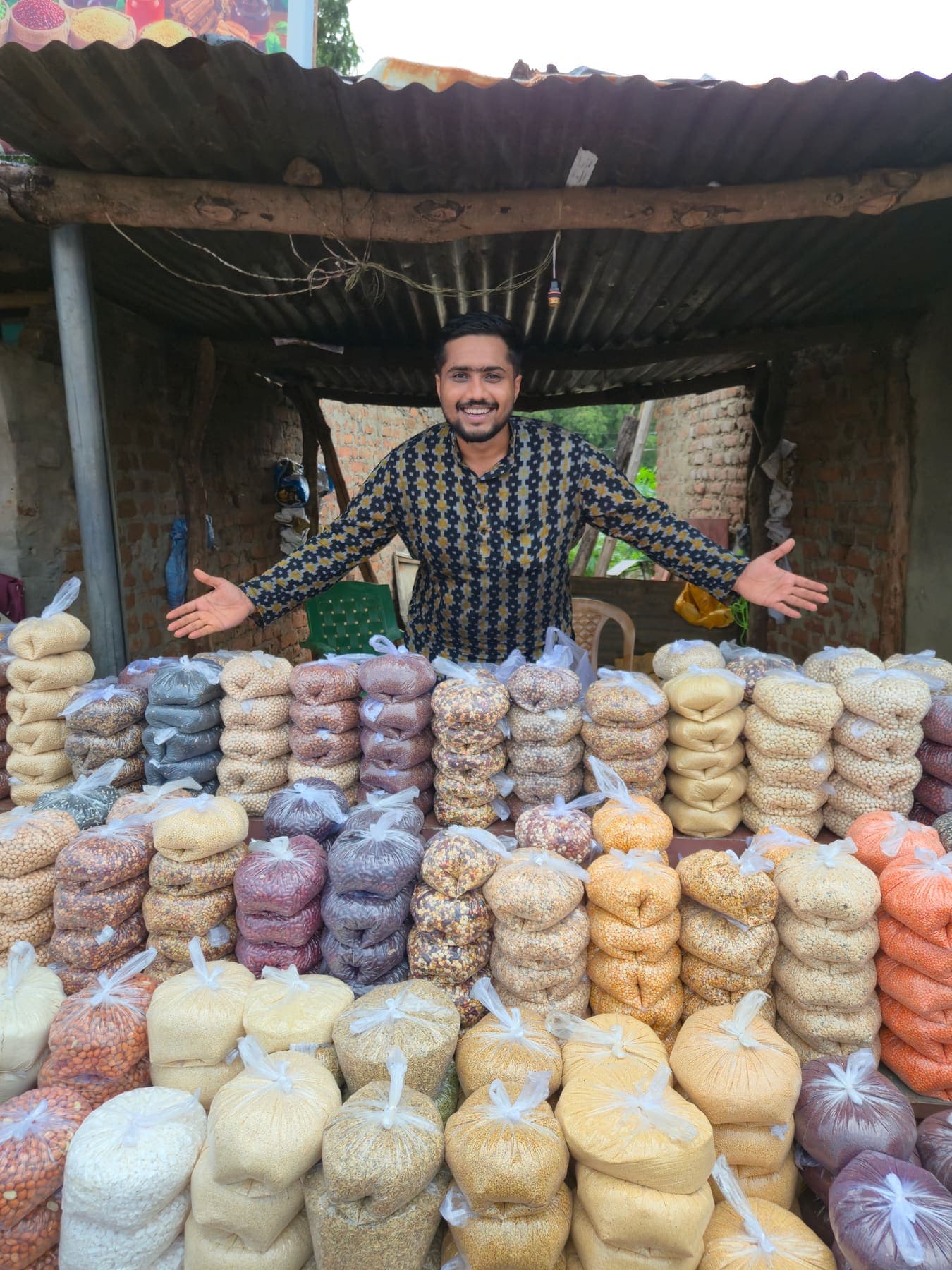 Producer standing behind a large graded produce display