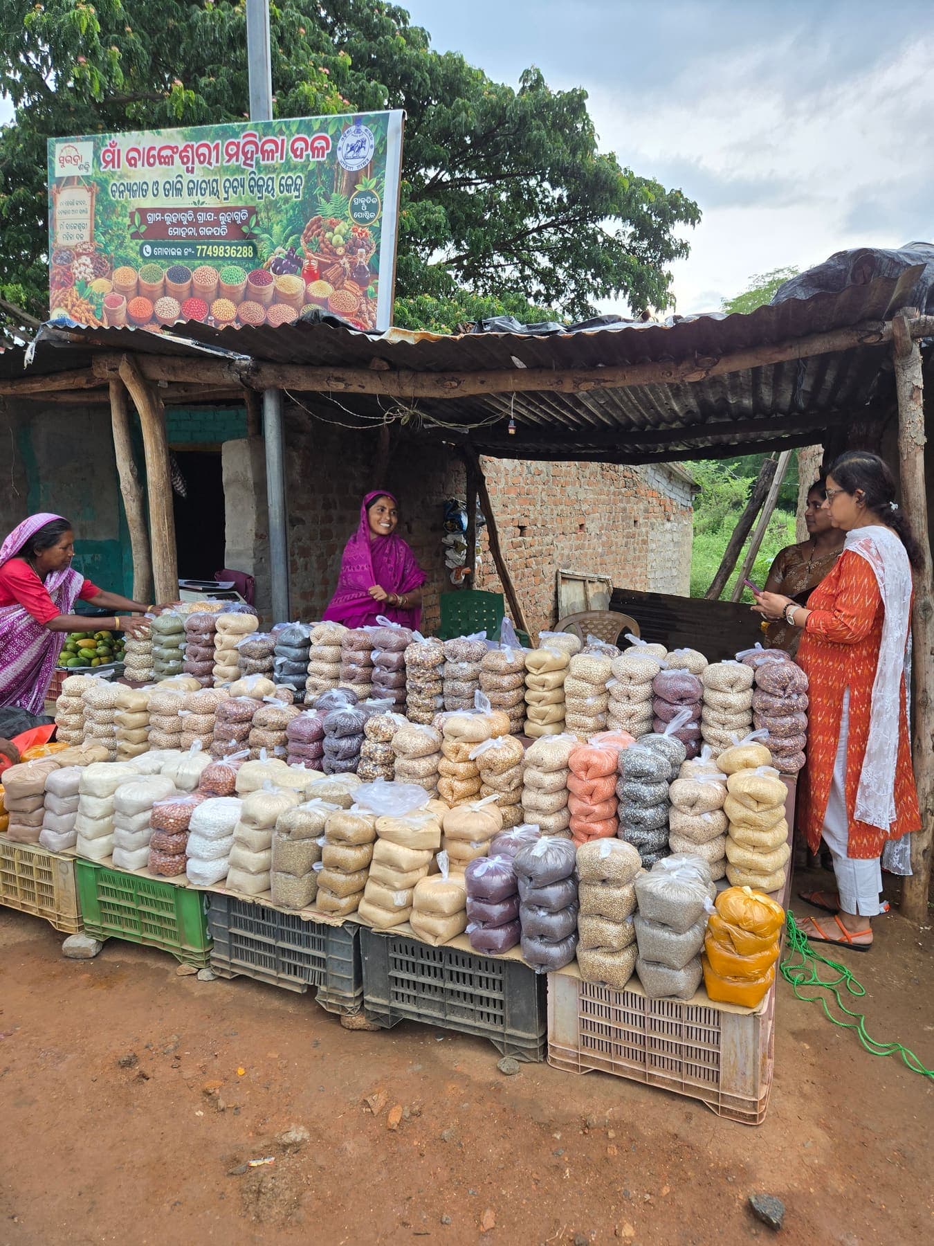 Producer collective stall in Gajapati with colour-coded produce packs