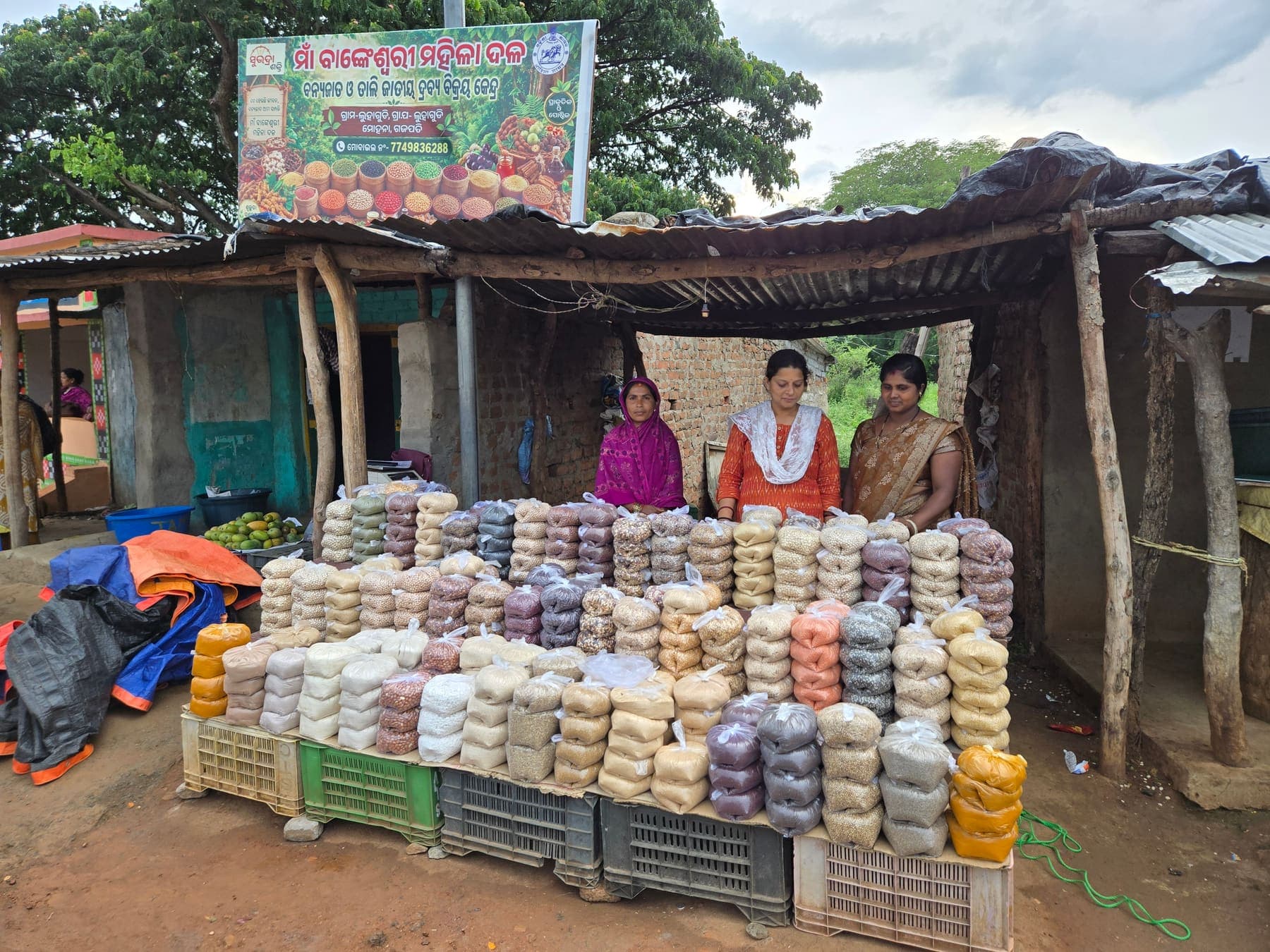 Wide view of a village producer collective market stall
